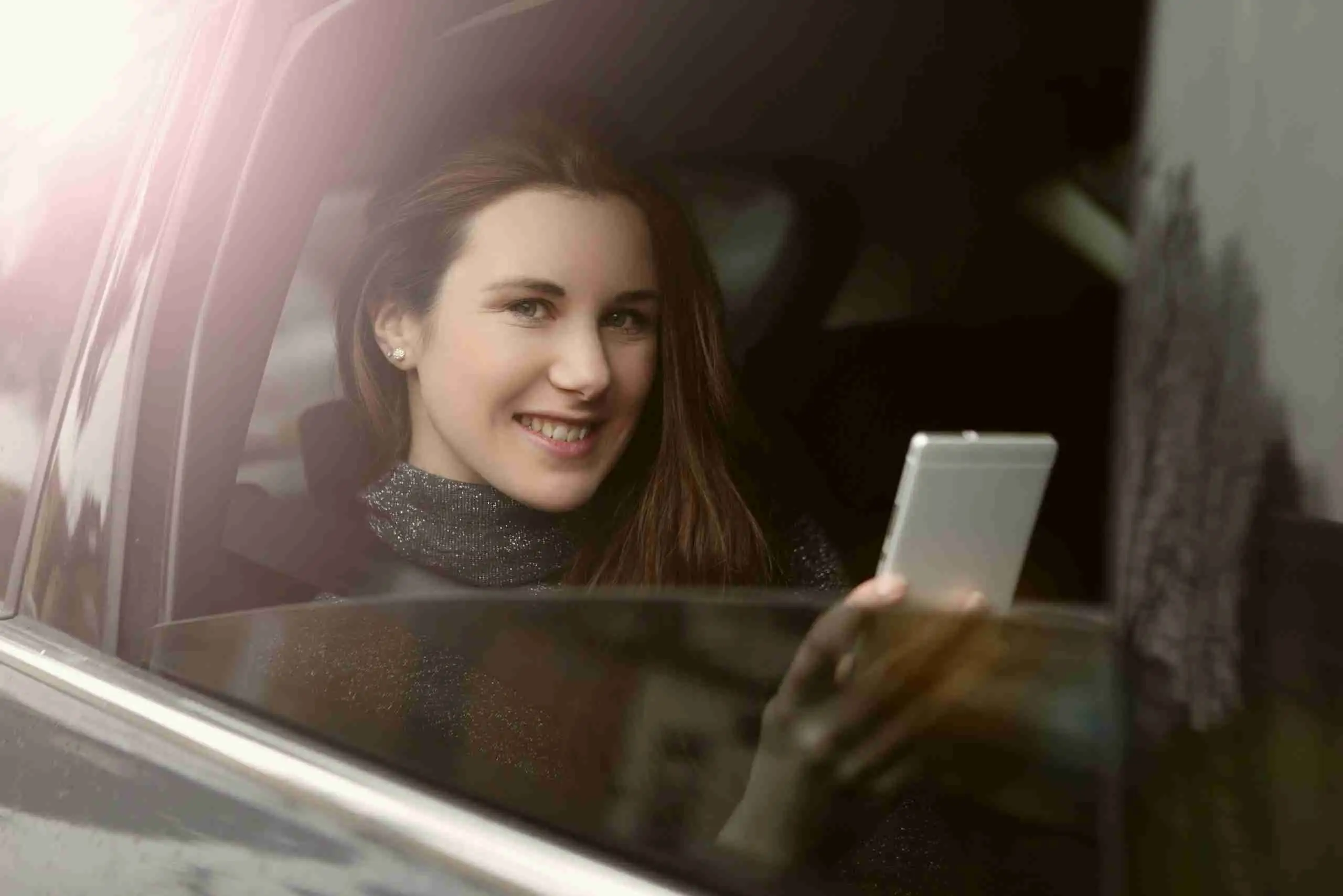 Passenger relaxing in the back seat of an electric taxi