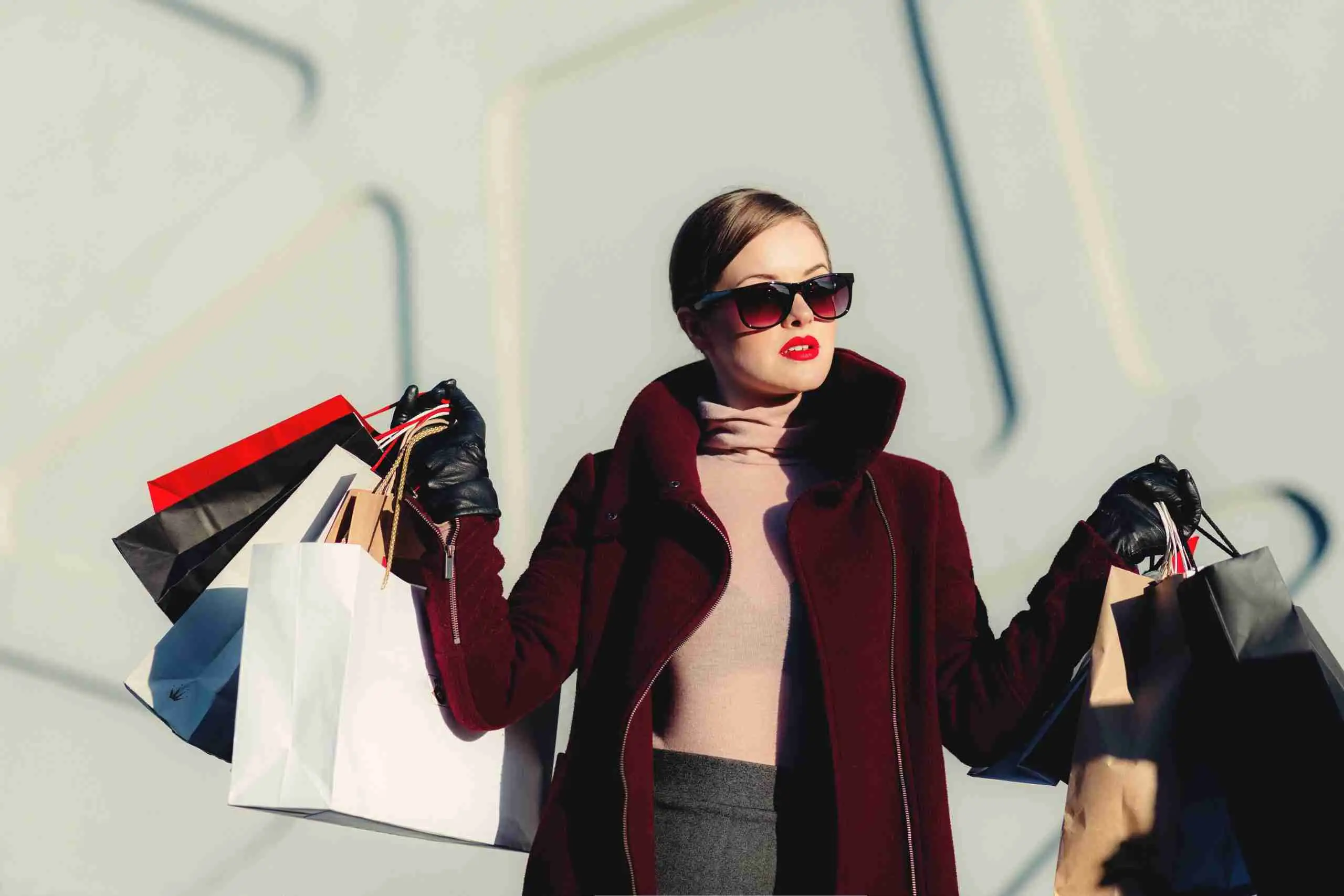 Shopping bags carried along a designer outlet street